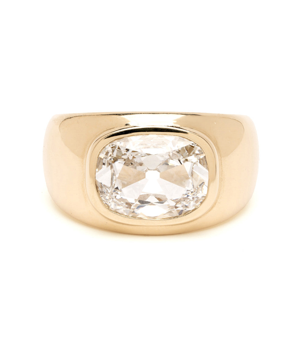 Gold ring with a large diamond on a white background