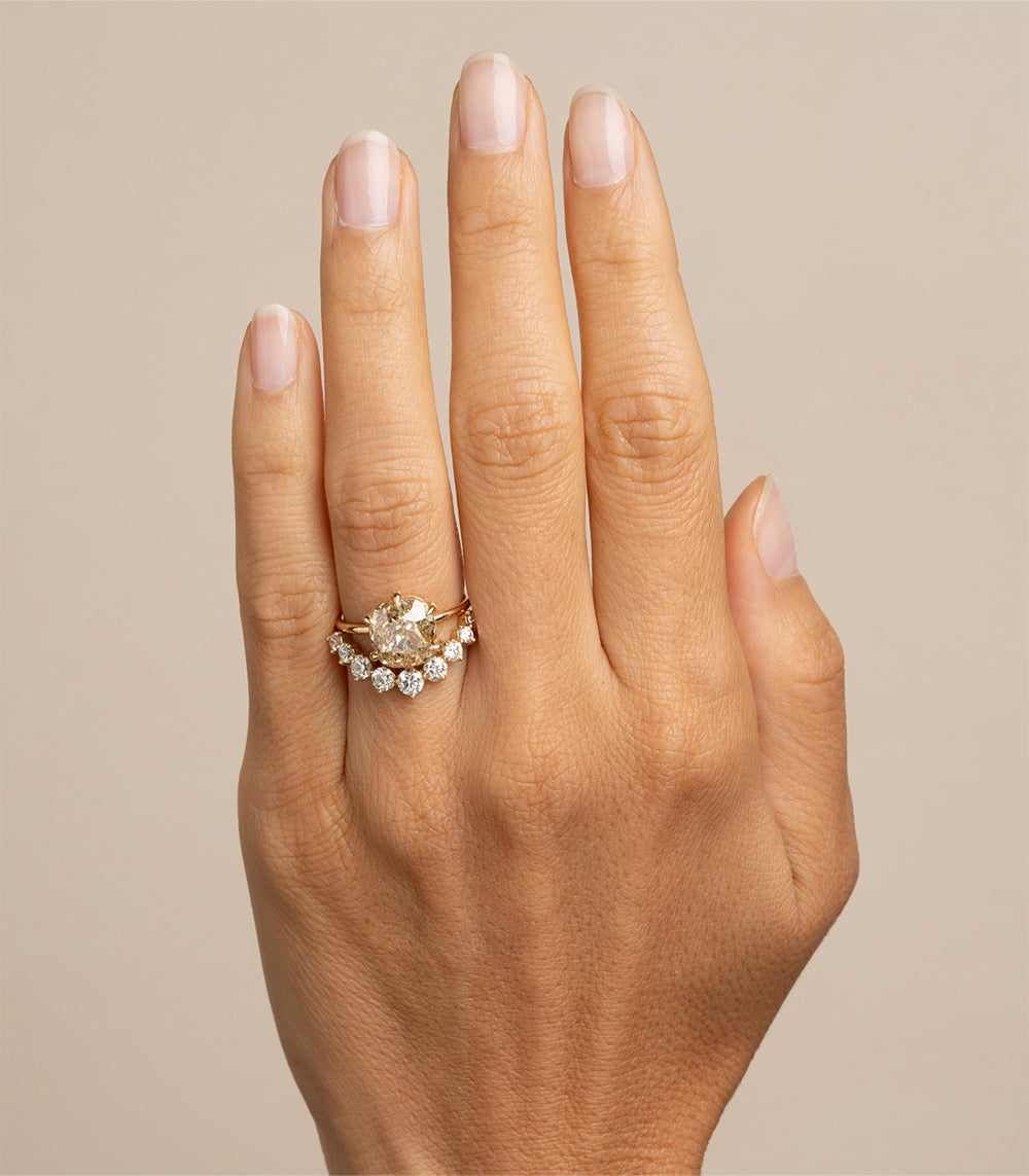 Ella SK-R62-ND-CU-CD-4.62 engagement ring in gold with round halo of clear stones on hand