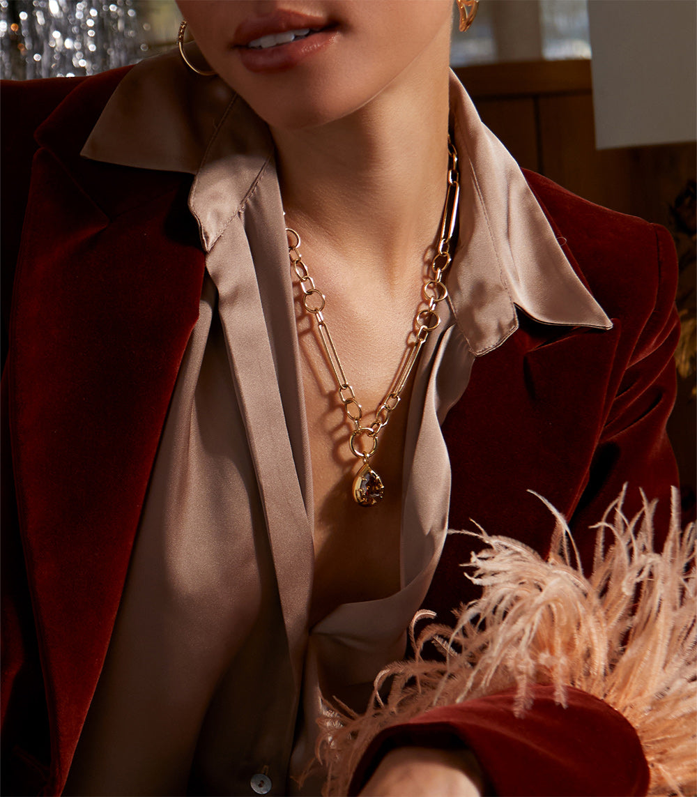 Cora Pendant KM-P8 layered gold chain necklace with warm amber gemstone charm at the center