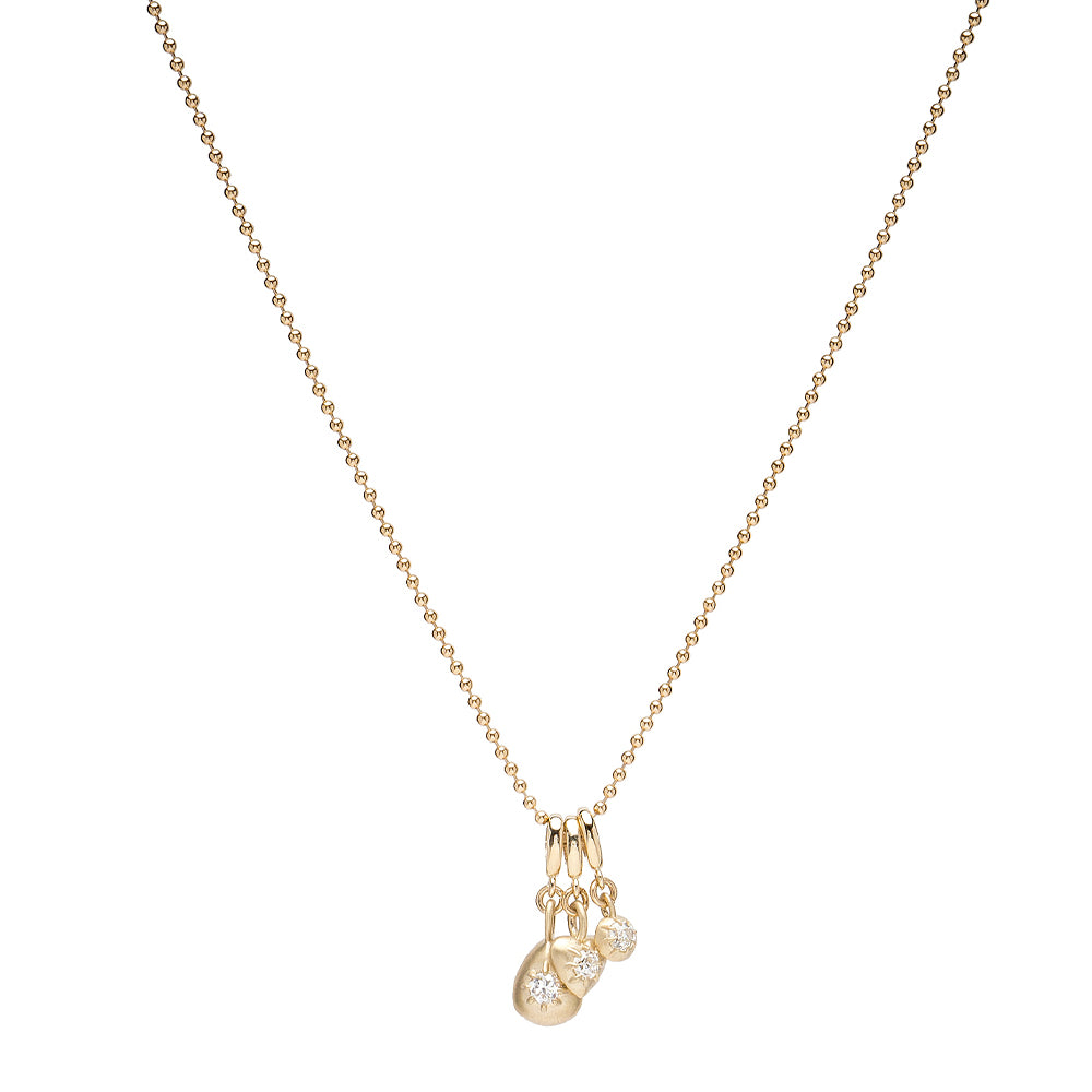 Cora Minis Charm Necklace by KM-N12 in gold with matte and shiny finish, small dangling charms