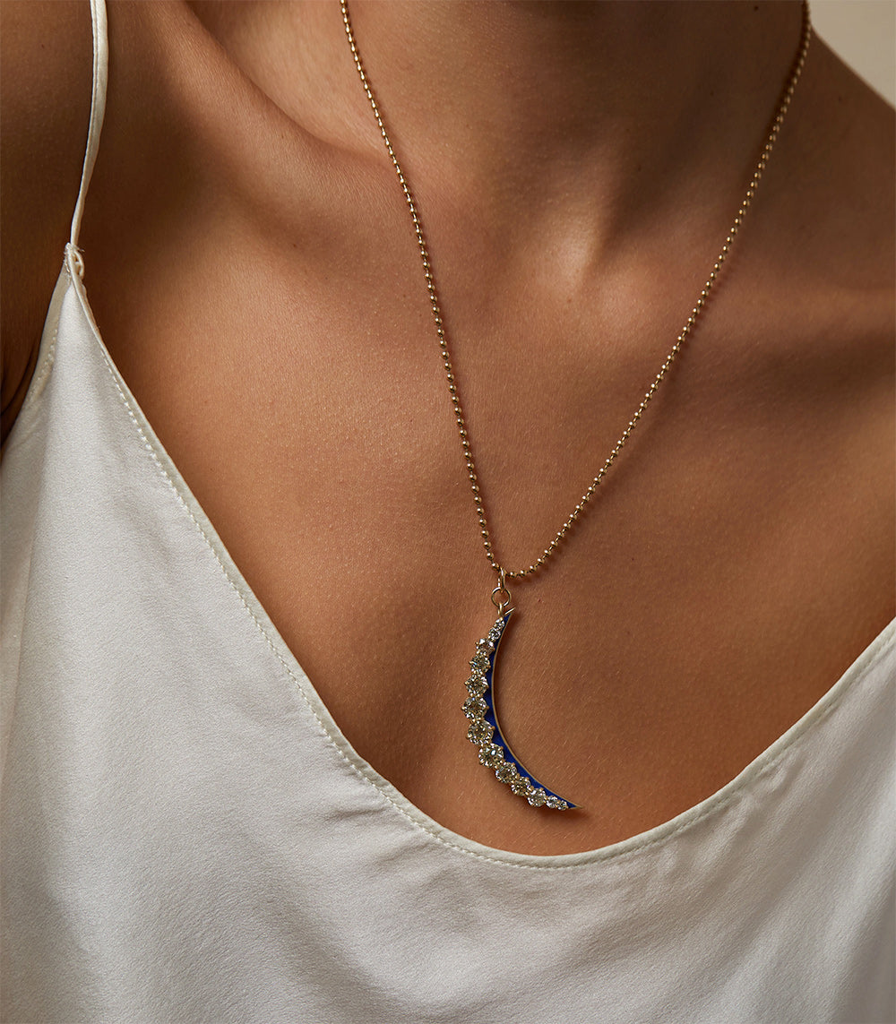 Feminine Divine by SK-P13 crescent moon necklace in gold with pavé stones pendant on model