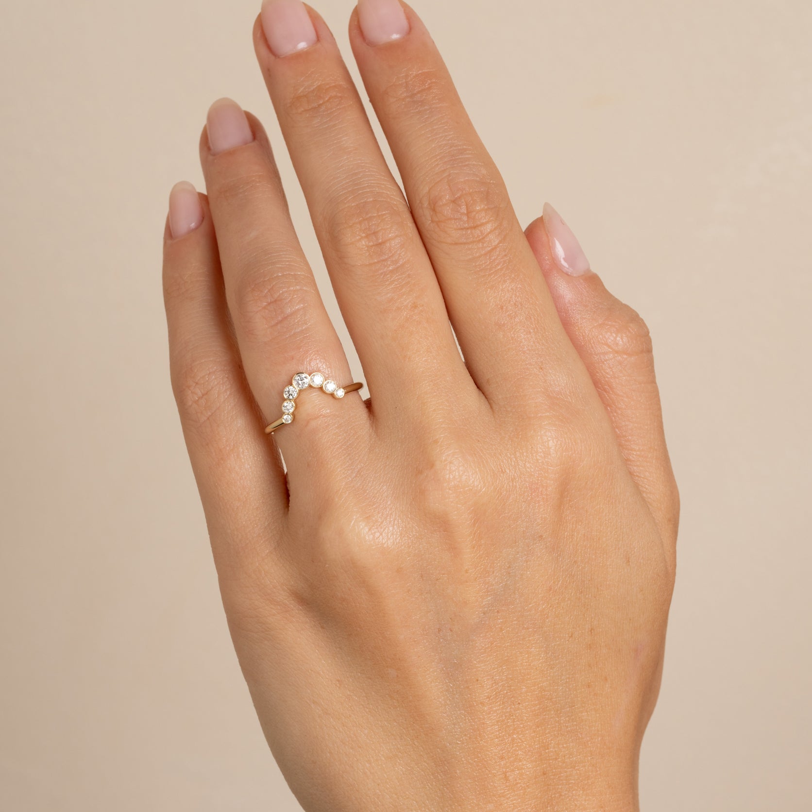 Bezels Sunrise Nesting Band AL-R18 bands in 14K yellow gold with bezel-set round diamonds on finger