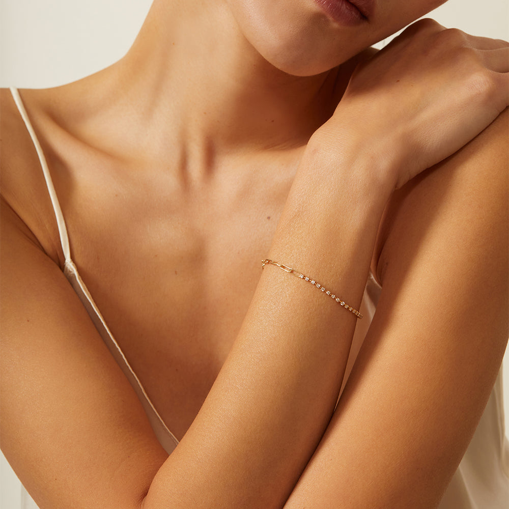 The Melrose CC-DB3 gold bracelet with fine pave stones on a wrist, soft studio lighting