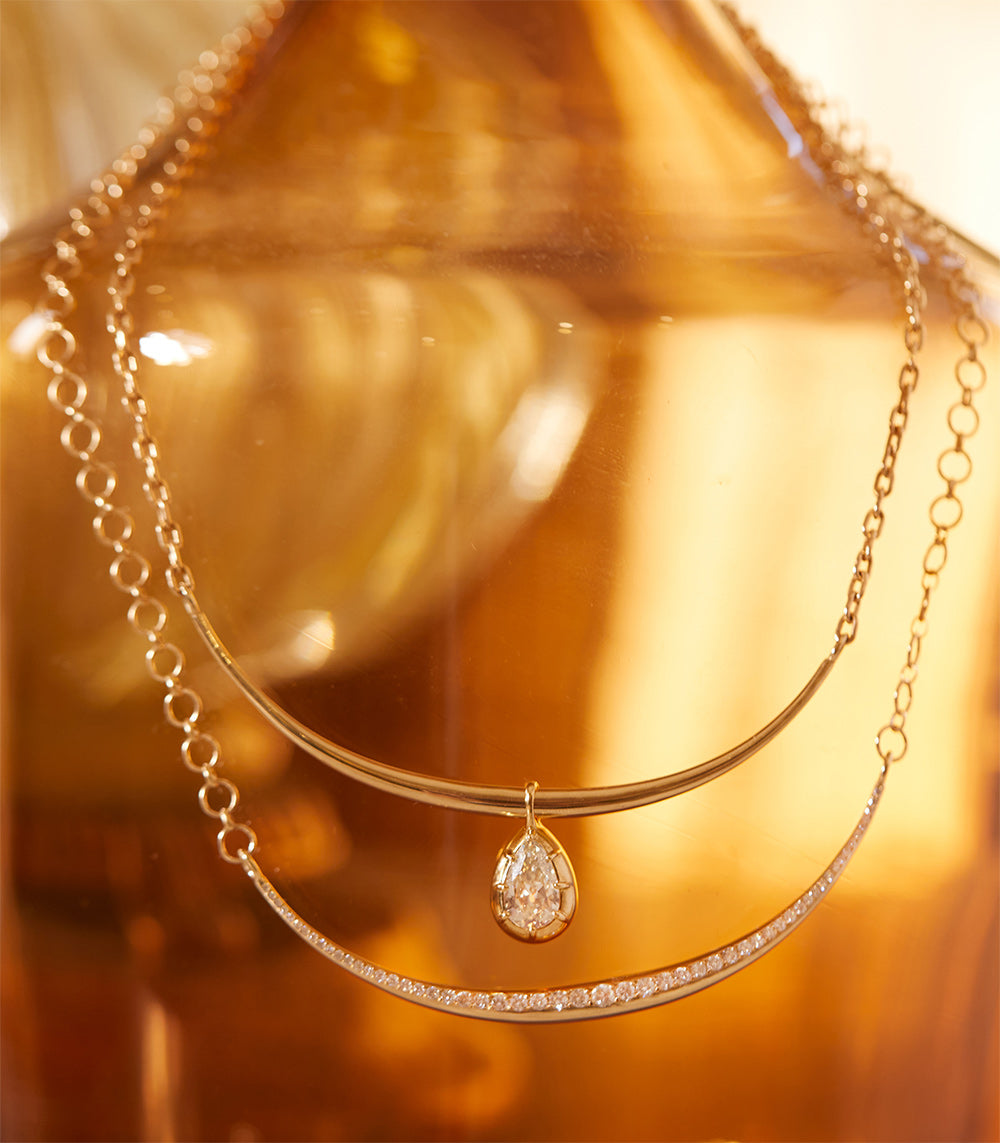 The Luna SK-N4 pendant necklace in warm gold tone with teardrop pavé diamond sparkle