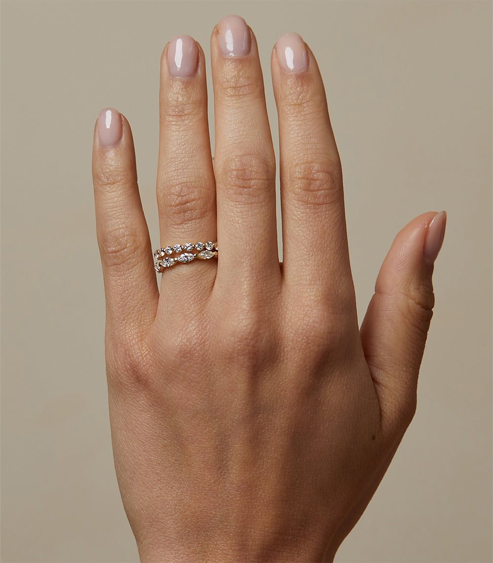 Kissing Diamonds EB-R18 band ring in 14K white gold with shiny diamond row on an open hand