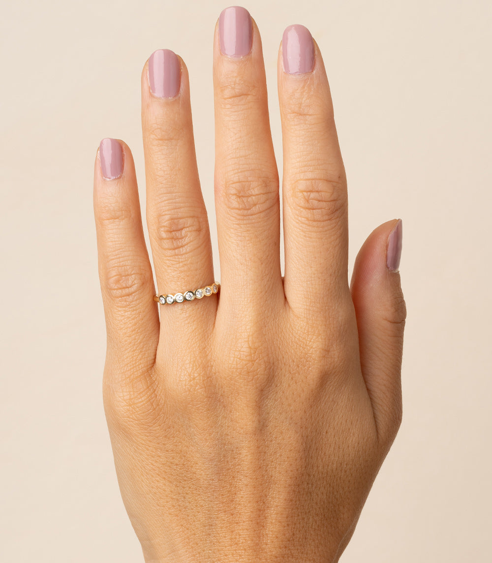 Diamond Bezels II EB-R17-D7 bands understated 14K yellow gold bezel set diamond ring on hand