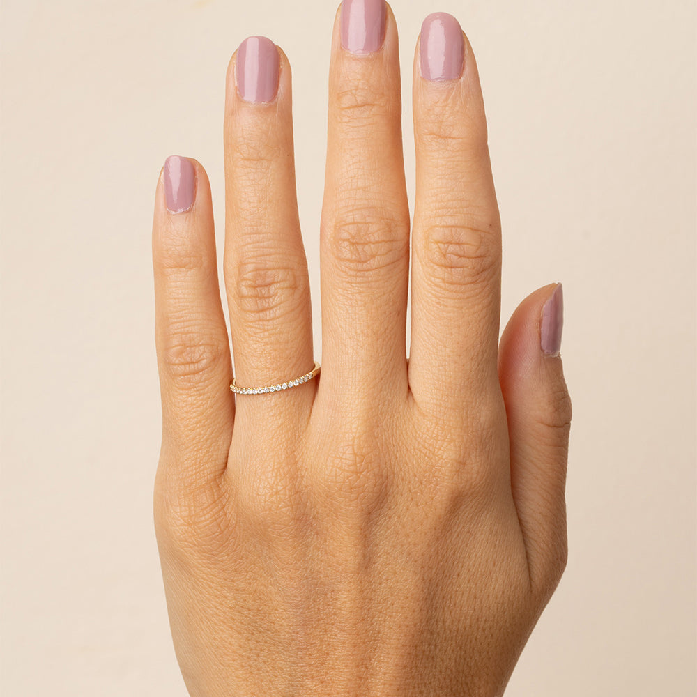 Classic Wire Band A-R29-WD shiny white gold wire band with closely set stones on finger