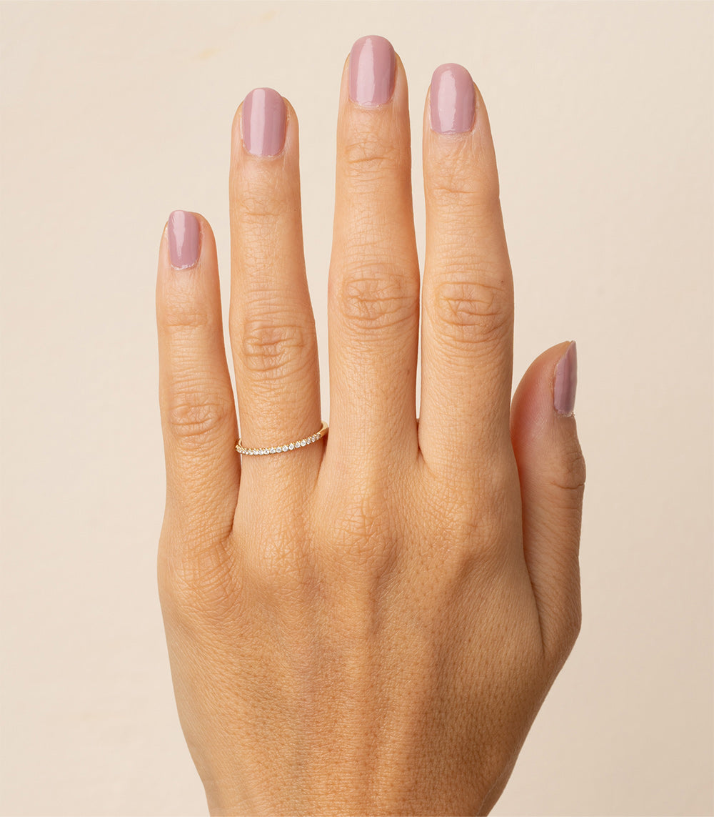 Classic Wire Band A-R29-WD shiny white gold wire band with closely set stones on finger