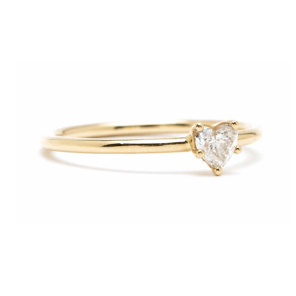 Beloved unique engagement ring by CT-R6 in polished 14K yellow gold, three-prong heart-cut diamond.