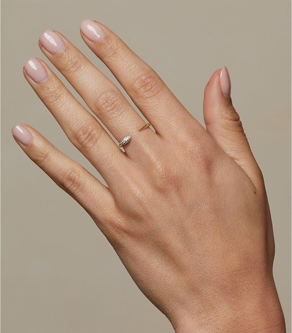 Comet Band NB-R1-D diamond ring in 14K yellow gold with a small sparkling stone set