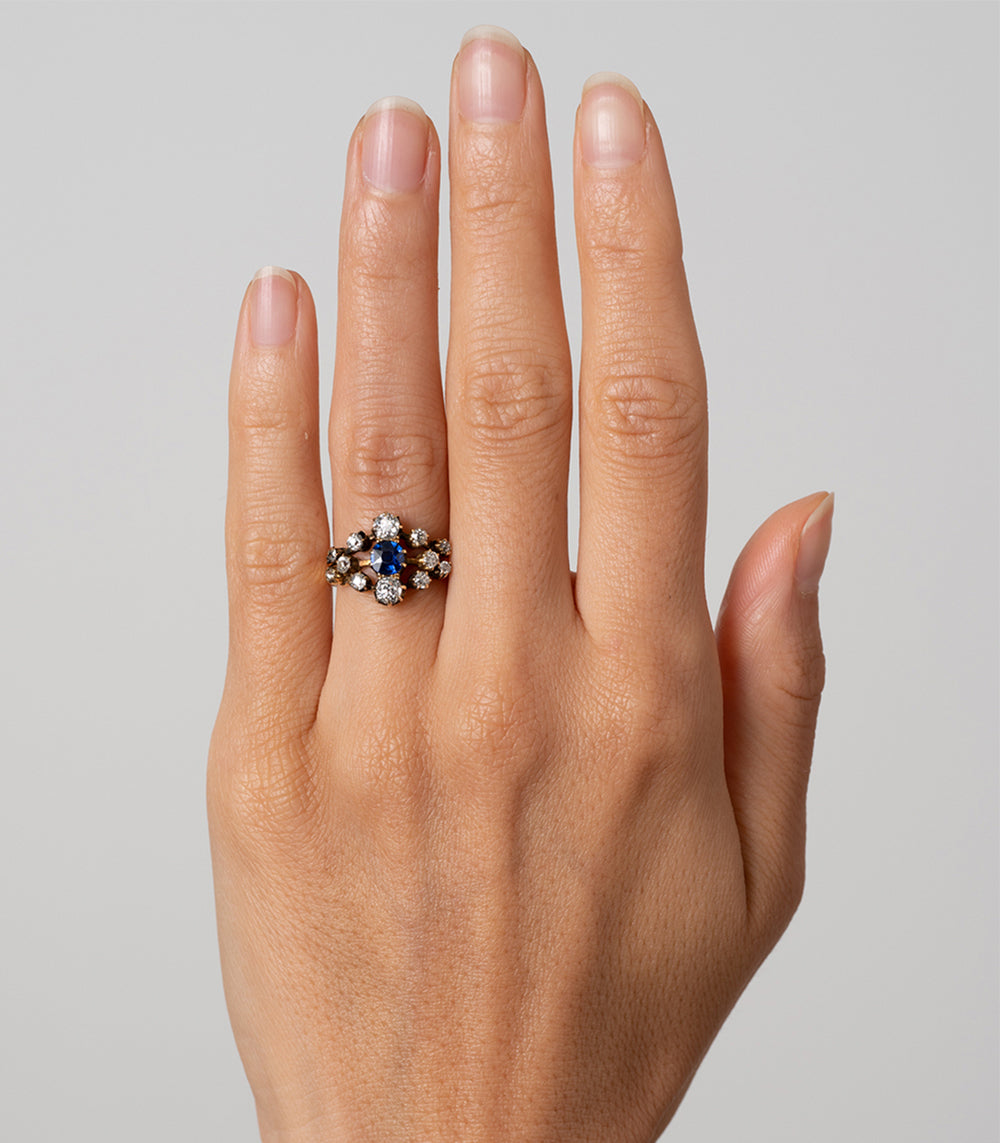 Anastasia VC-R168 engagement ring in silver with blue center stone and round diamond clusters