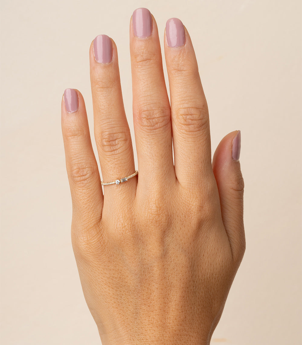 Confetti Band by A-R47 14K white gold band with shiny confetti-style stones on a hand