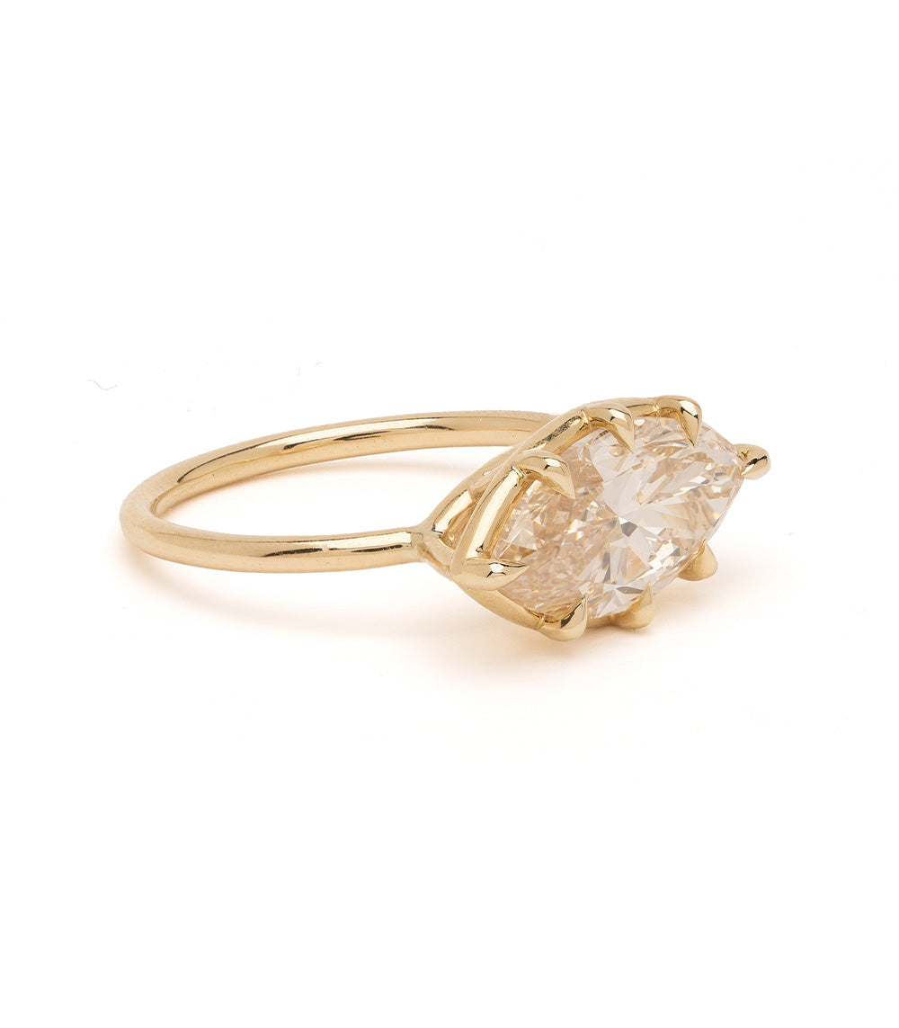 Gigi Sofia Kaman engagement ring in gold with a faceted natural drop diamond setting