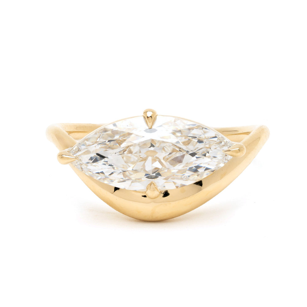 Melt Solitaire ring by Sofia Kaman in yellow gold with a clear solitaire diamond centerpiece—unique engagement ring, understated.