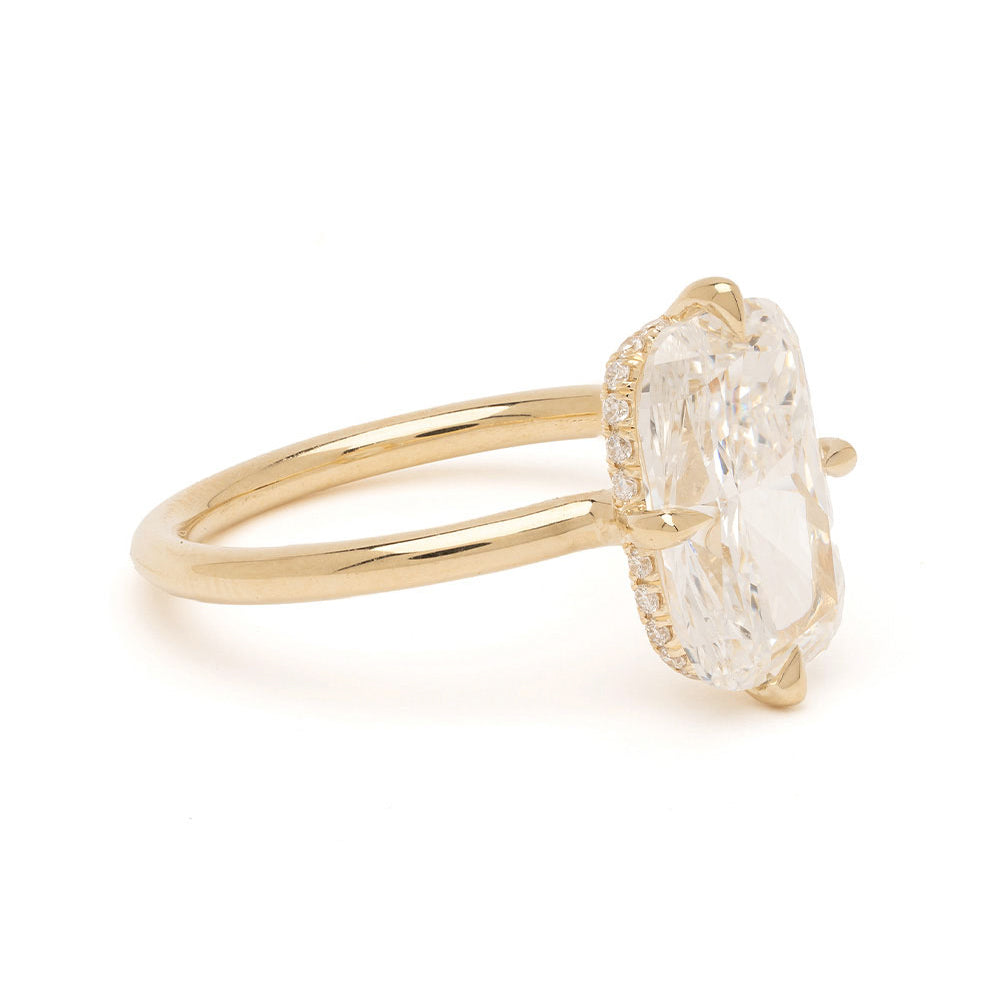 Billie by Sofia Kaman gold engagement ring with oval-cut diamond cluster bezel setting