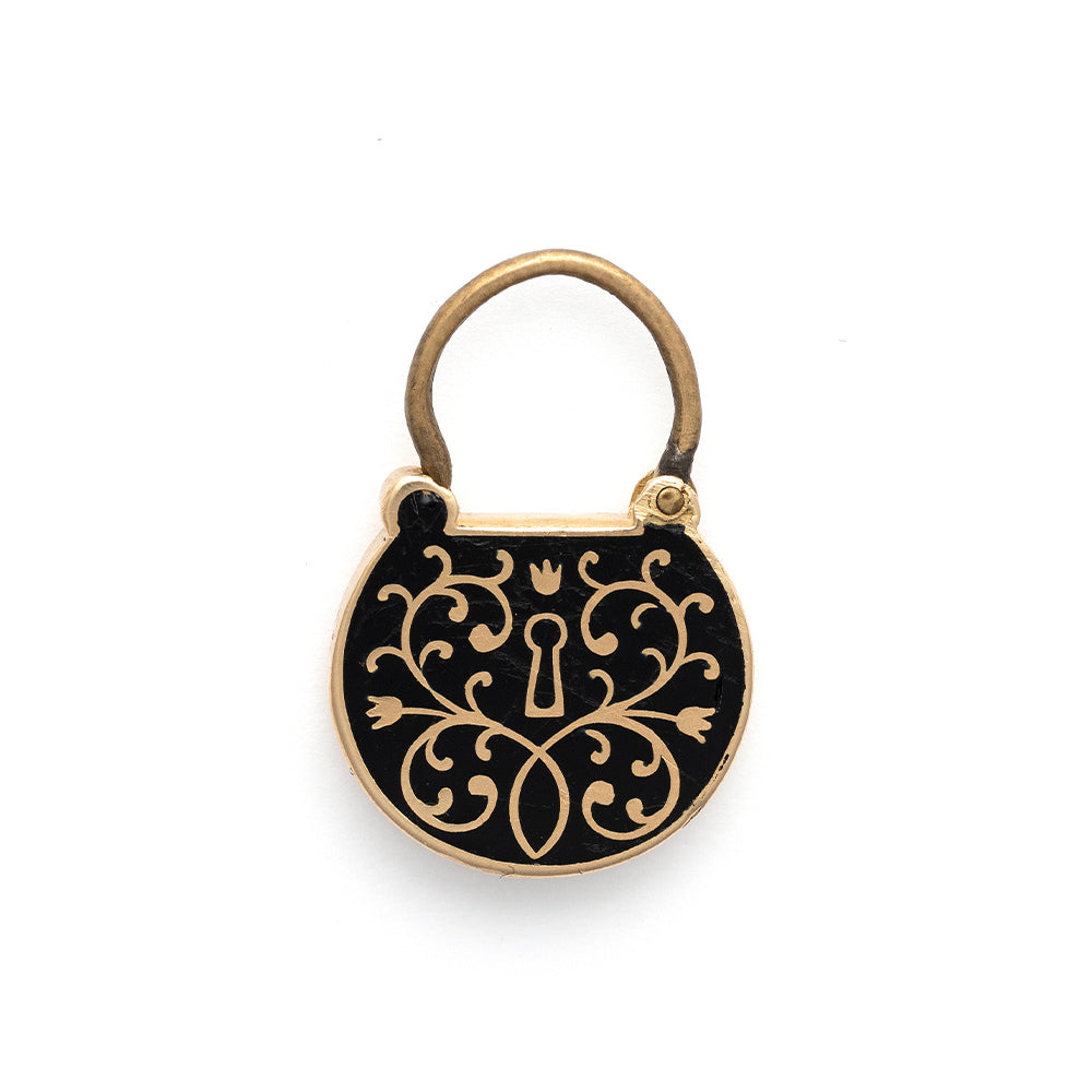 All Locked Up Charm by VC-P11 gold and black enamel charm with ornate keyhole scrollwork motif.