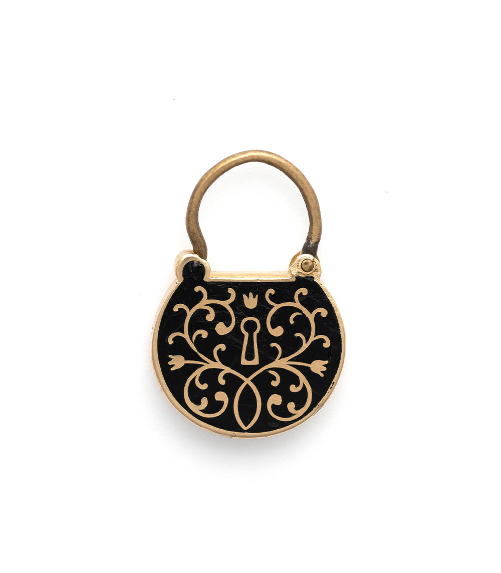 All Locked Up Charm by VC-P11 gold and black enamel charm with ornate keyhole scrollwork motif.