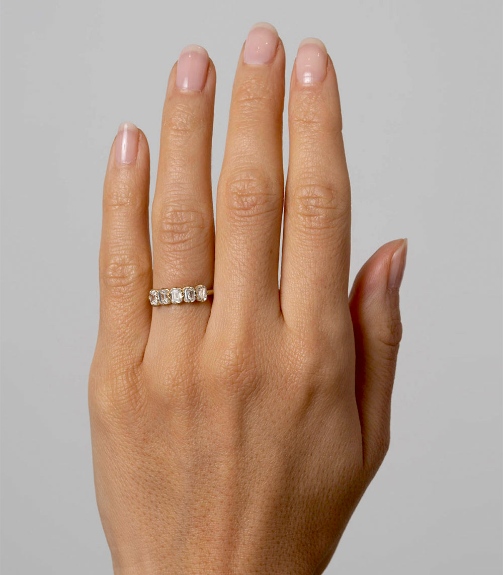 Claudette 5 Stone Band by SK-R68-Band-EC understated ring with five small clear stones on a hand