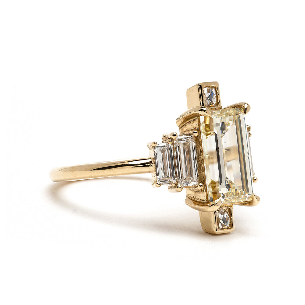 Xena SK-R90 gold 3 stone engagement ring with rectangular emerald-cut diamonds on white background