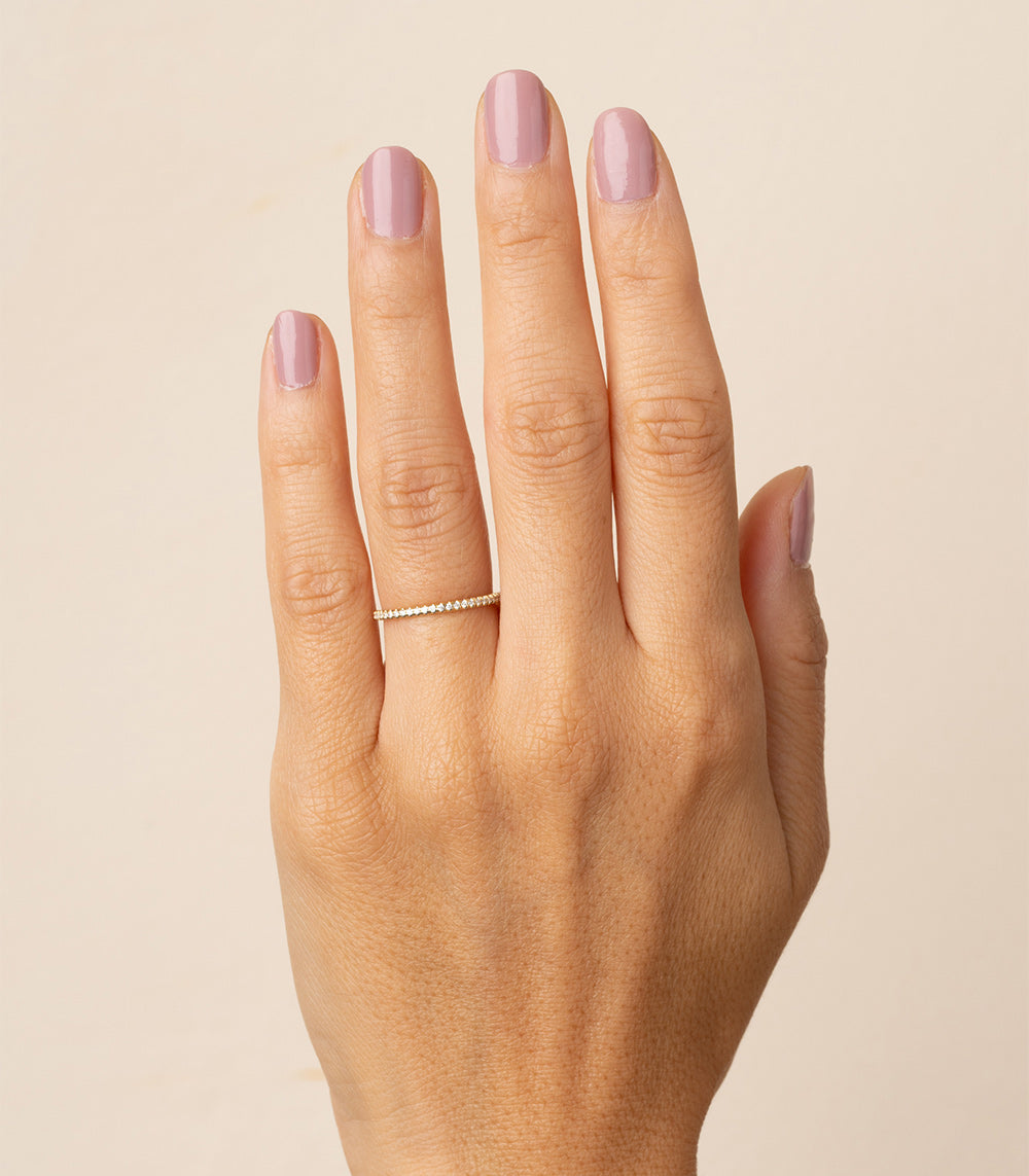 Classic Wire Band by EB-R9, 14K yellow gold shiny wire band with small stones on hand