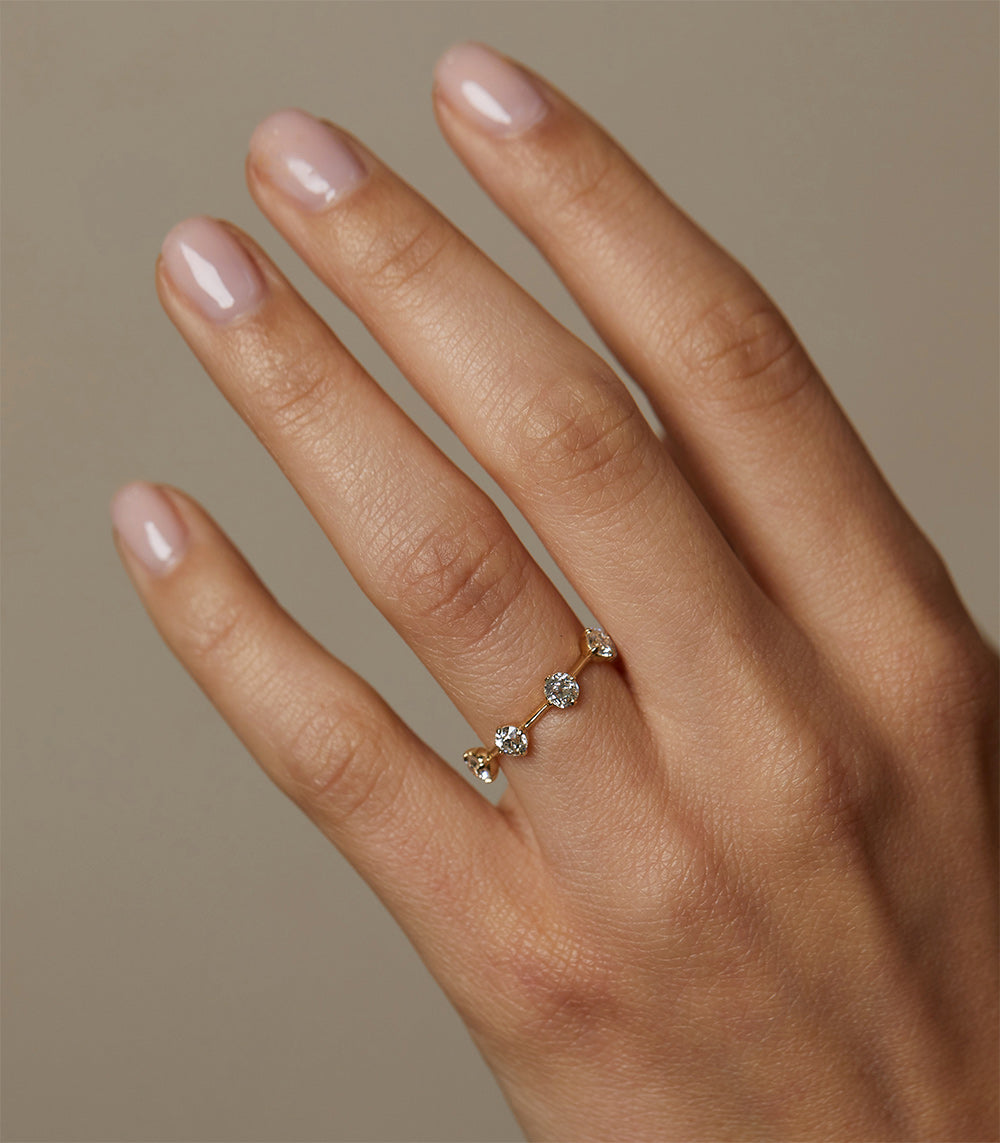 Estée Band SB-R2 14K yellow gold band with shiny finish and 3 stone engagement ring on hand
