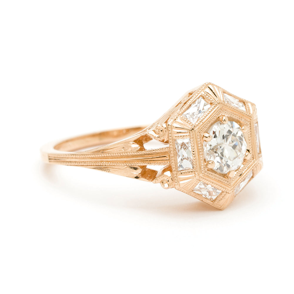 Zelda SK-R54 filigree gold engagement ring with a geometric halo and three faceted stones—warm shine