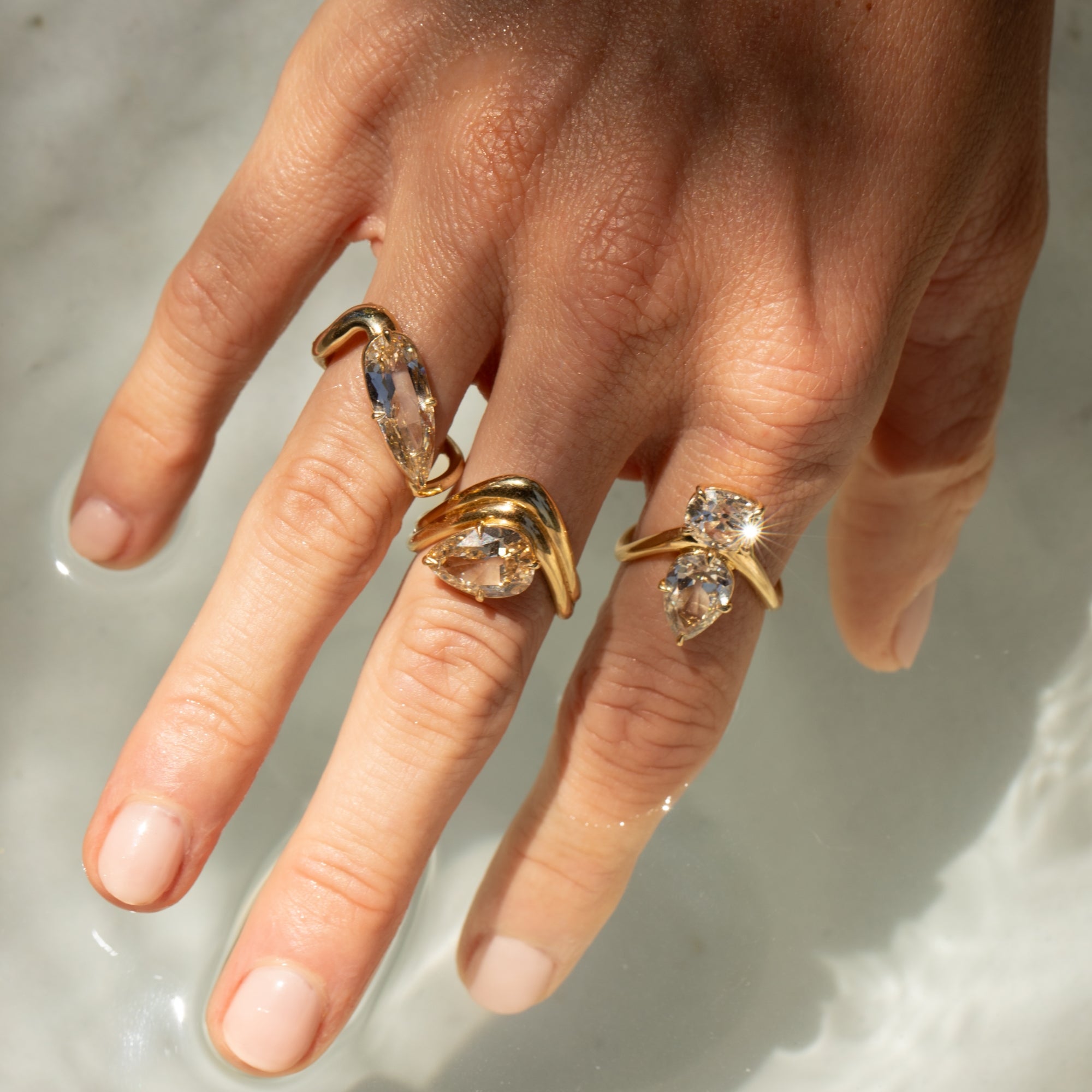 Melt Toi et Moi by Sofia Kaman unique engagement ring in warm gold with oval stones