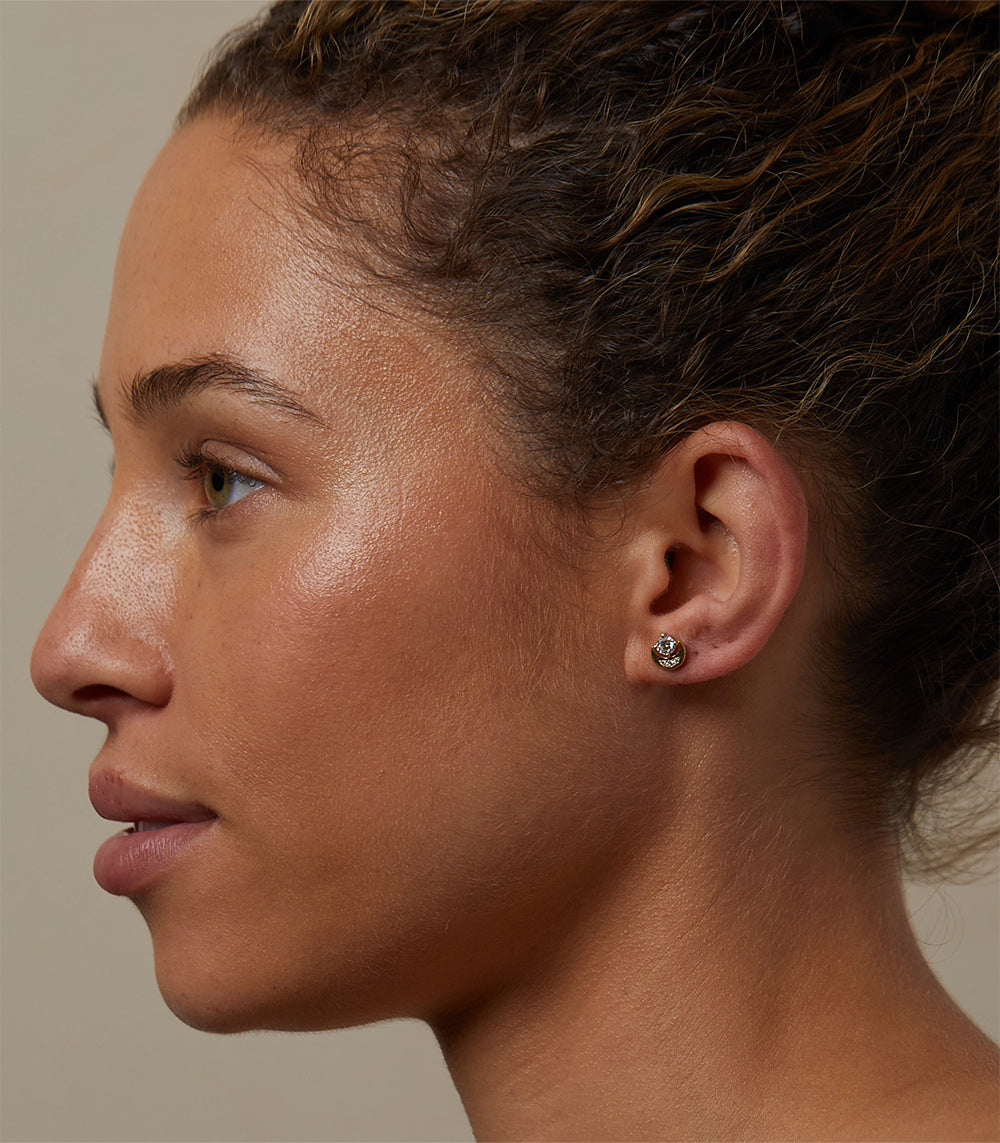 Boho Crescent Studs SK-E5-D boho crescent stud earrings in yellow gold with shiny finish on model