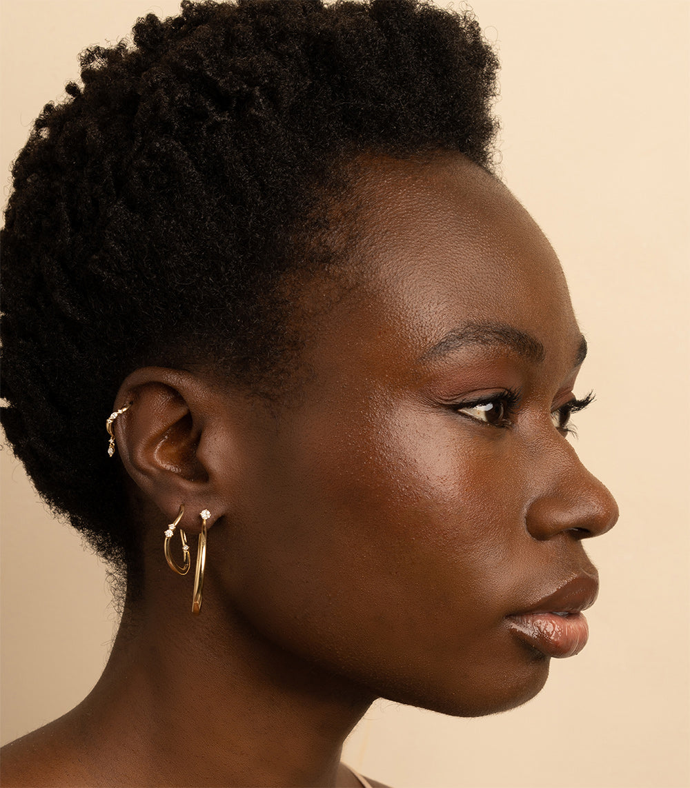 Medium Melt Hoops by ML-E3 gold hoop earrings with shiny and matte finish and small stone detail