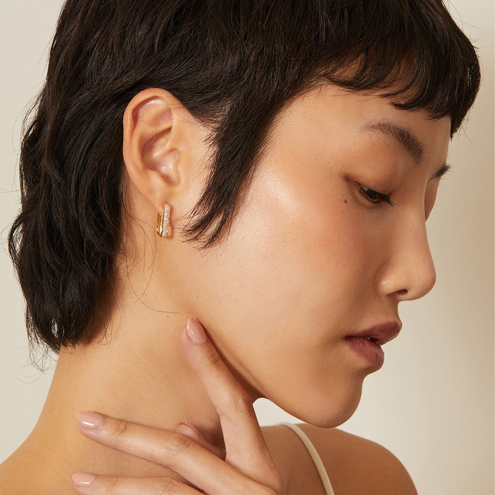 The Robertson by CC-E1 understated gold hoop earrings with slim setting and warm metallic shine