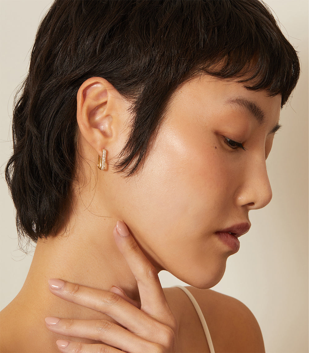 The Robertson by CC-E1 understated gold hoop earrings with slim setting and warm metallic shine