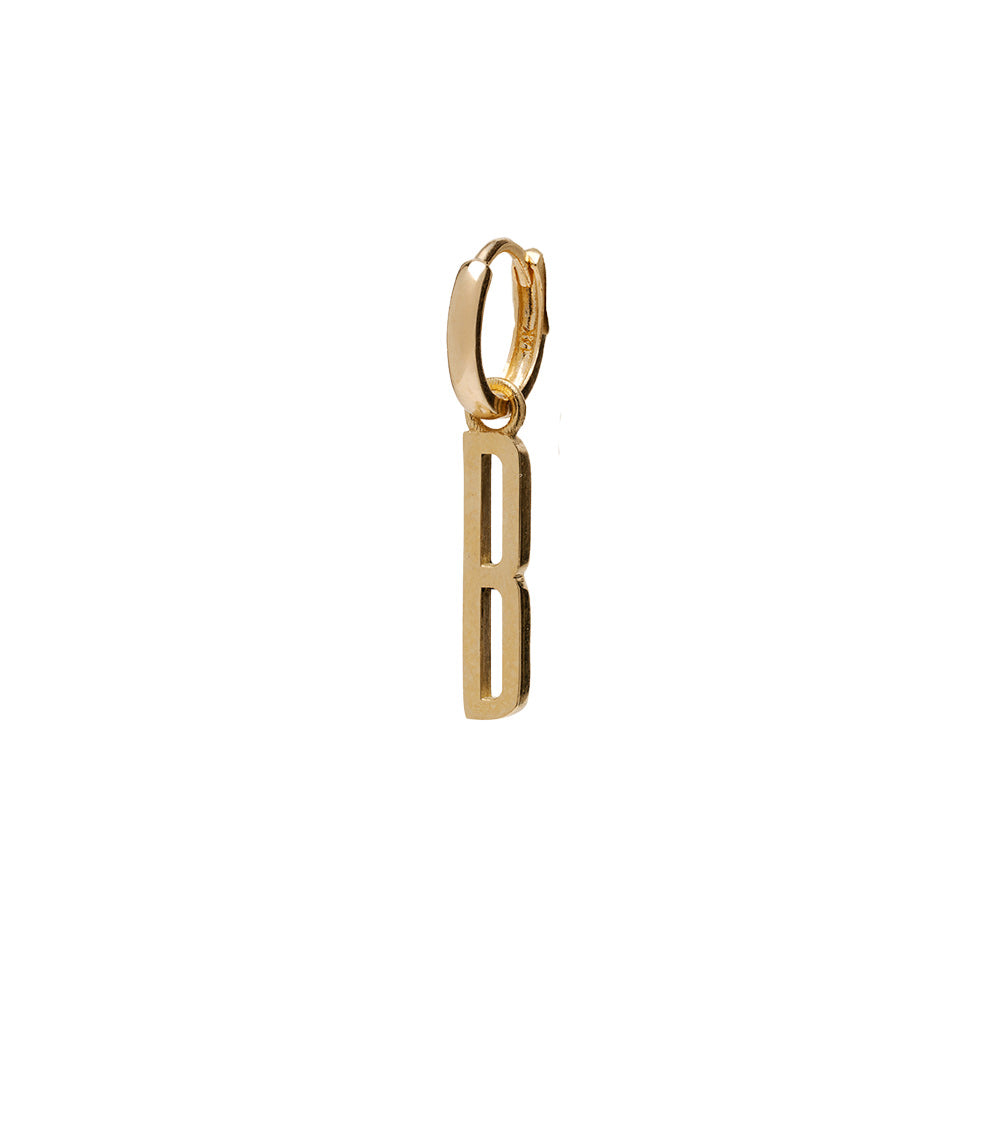 ID HUGGIE NO.1 by ID-E1 gold huggie hoop earrings with vertical cutout charm—minimal style