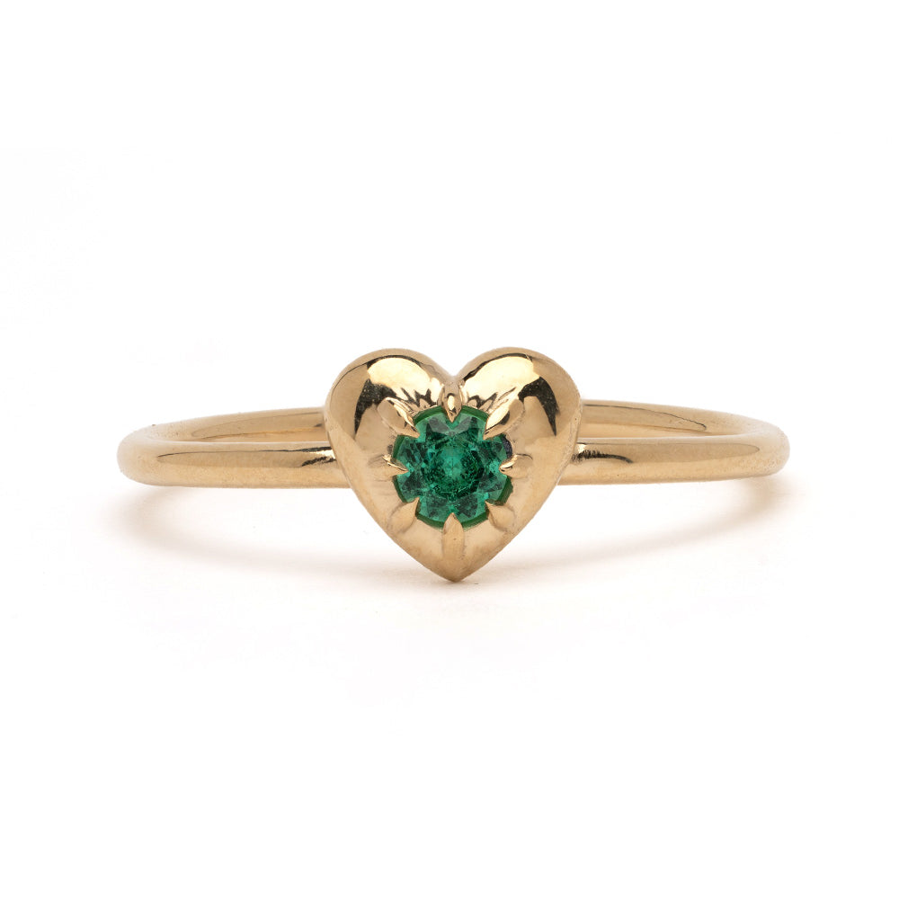 ID RING NO.2 by ID-R2 14K yellow gold heart ring with green gemstone center, close-up.
