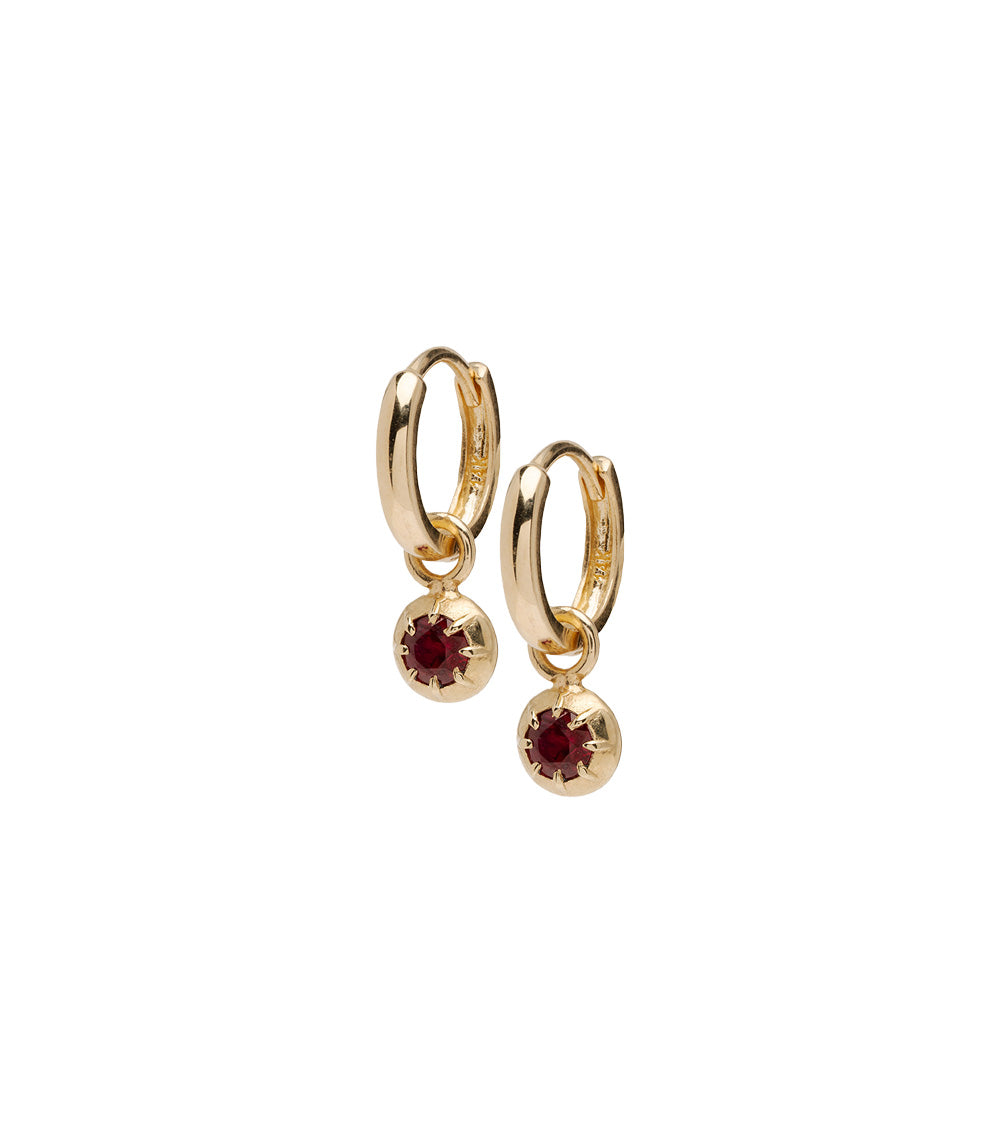 ID HUGGIE NO.2 by ID-E2 gold huggie hoop earrings with red gemstone drops, hinged clasp