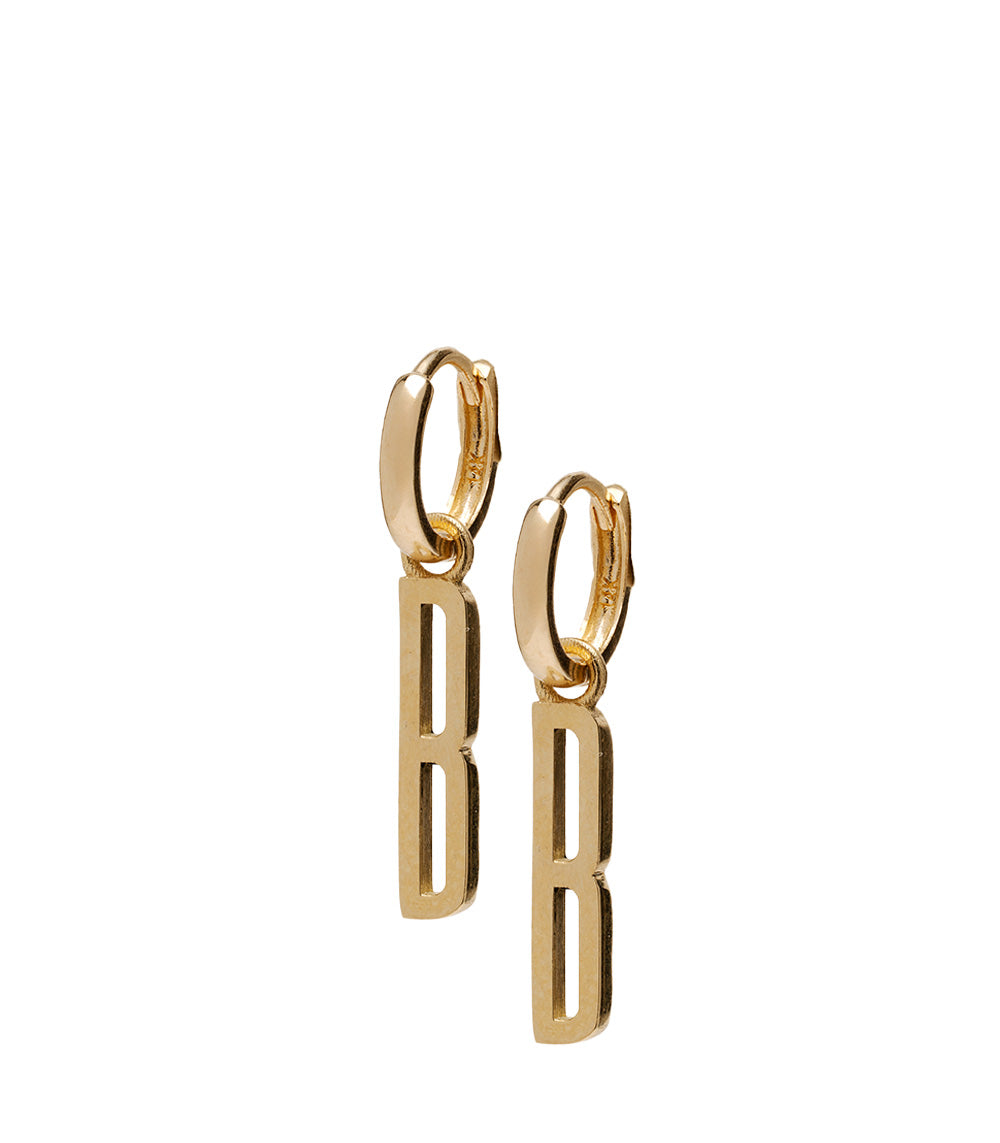 ID HUGGIE NO.1 by ID-E1 gold hoop earrings with dangling vertical bar cutouts, minimal polished finish.