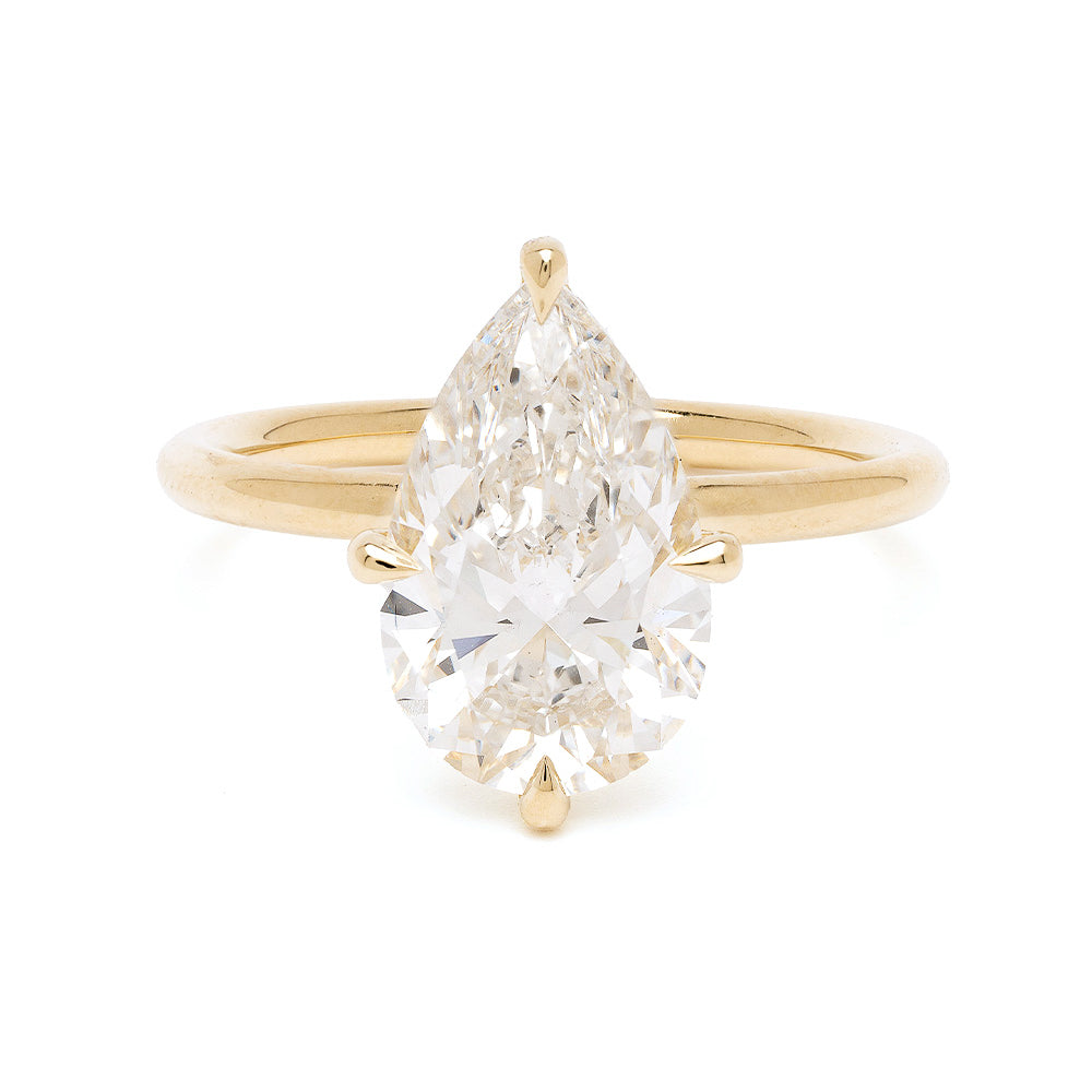 Billie Sofia Kaman engagement ring in yellow gold with a unique engagement ring oval diamond center