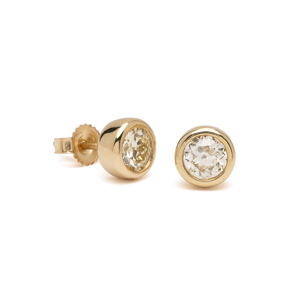 Diamond Bezel Studs by T-E15-OMC diamond stud earrings in 14K yellow gold, round shiny bezel.