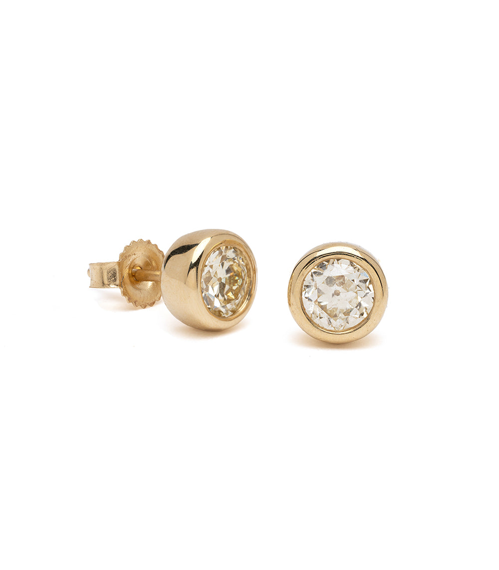 Diamond Bezel Studs by T-E15-OMC diamond stud earrings in 14K yellow gold, round shiny bezel.
