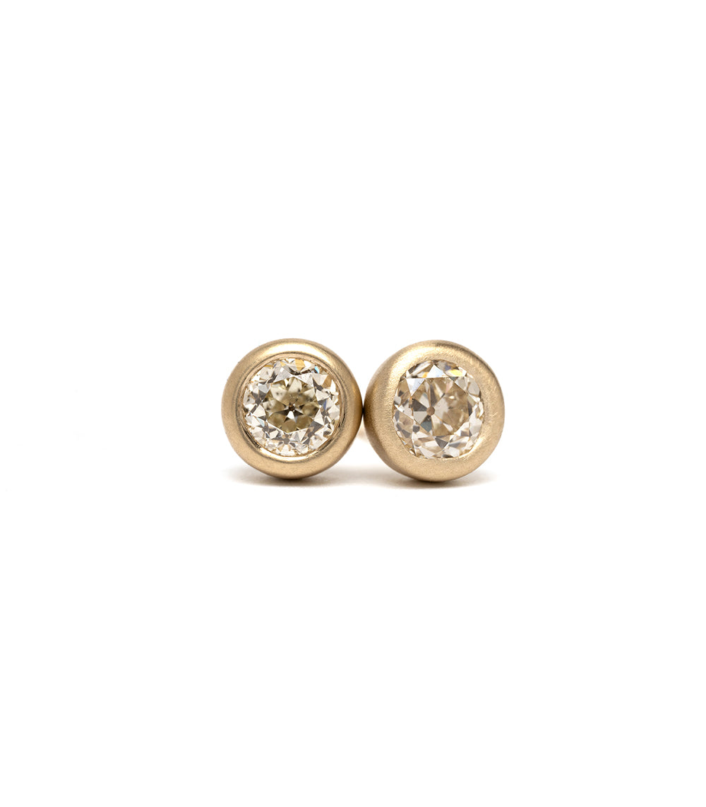 Diamond Bezel Studs by T-E15-OMC in 14K yellow gold, shiny round bezel diamond studs.