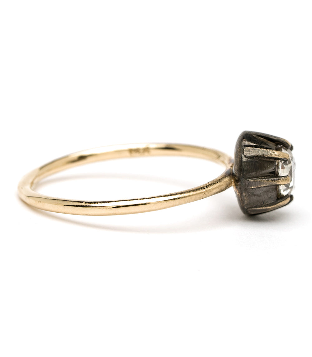 Cora SK-R28-OMC-CD-MD gold engagement ring with dark setting and clear center stones, understated.