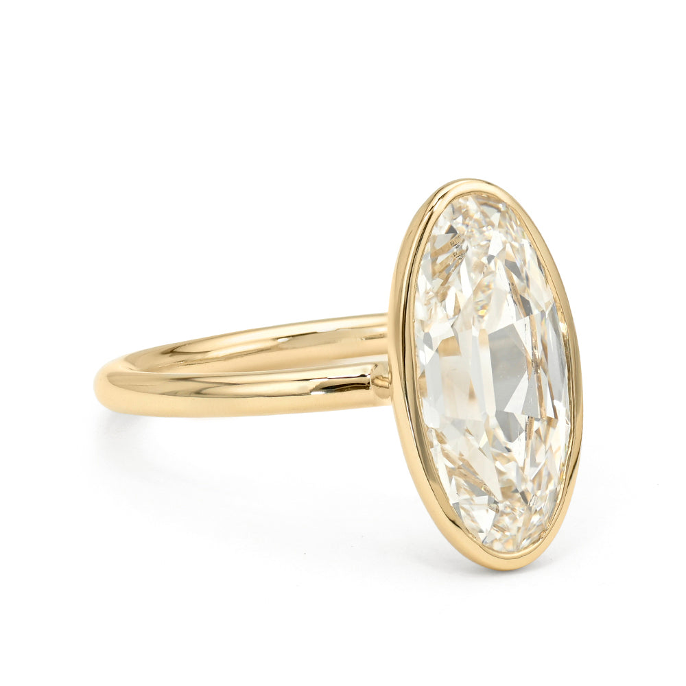 Billie Bezel by Sofia Kaman engagement ring in yellow gold with oval bezel-set diamond