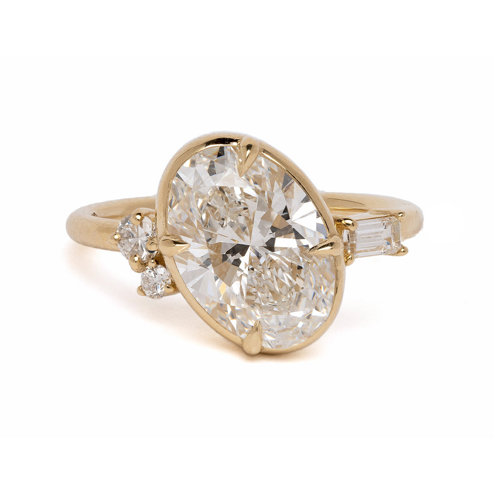 Sydney by SK-R96-LGD-OC-3.01 gold 3 stone engagement ring with oval center diamond and side stones