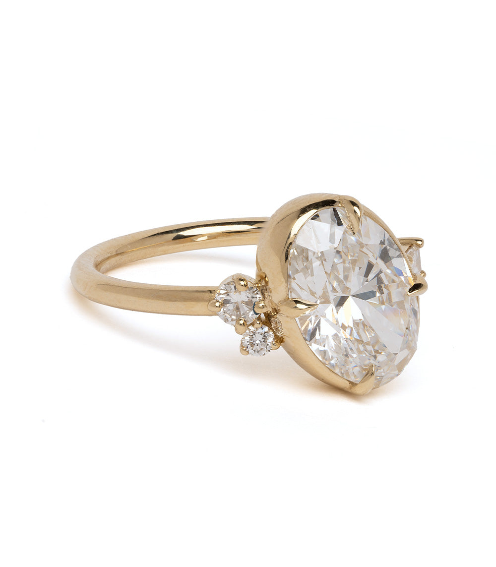 Sydney SK-R96-LGD-OC-3.01 gold engagement ring with large oval diamond and two small stones.