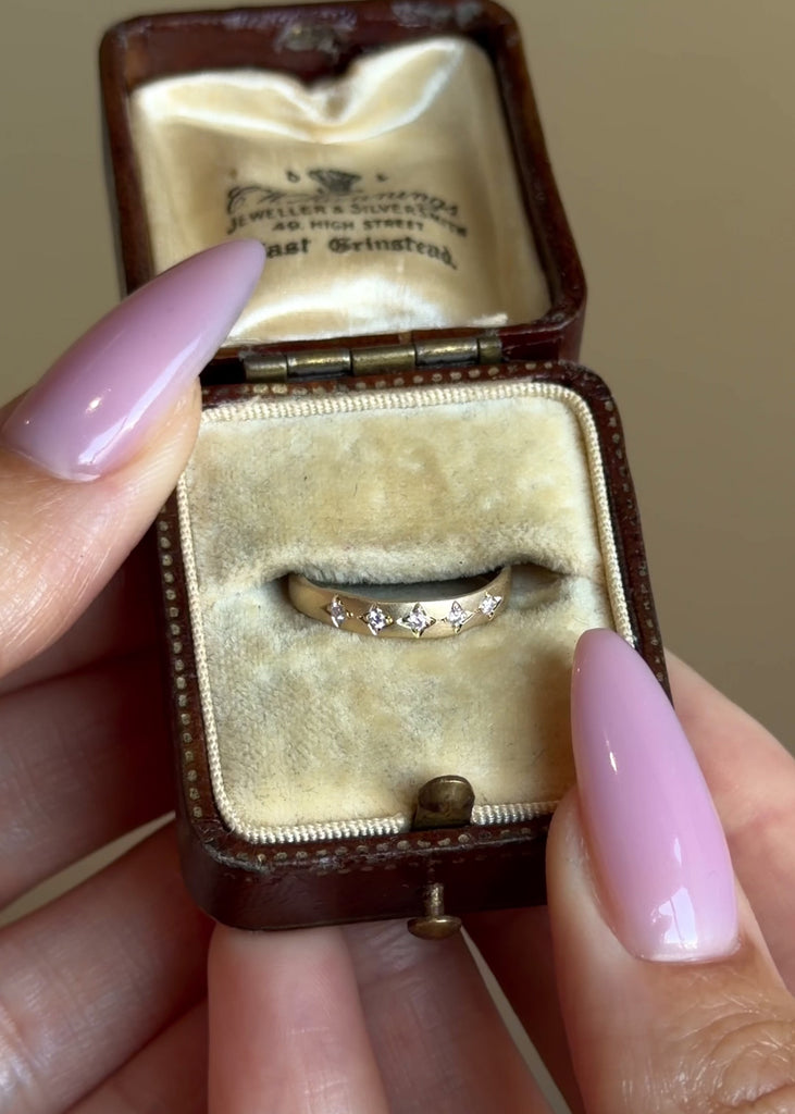 Gold band with organic edges, matte finish and 5 round brilliant natural diamonds set in a star pattern made in 14K gold and available in pinky ring sizing.