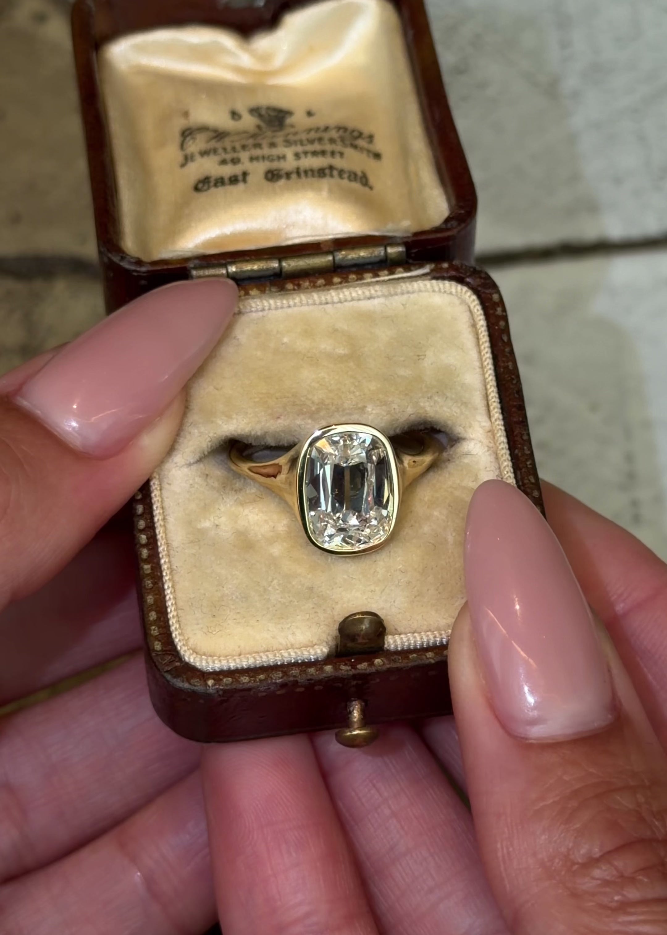 old mine cut style lab diamond cushion cut in a bezel-set signet style engagement ring in 1 shiny yellow gold