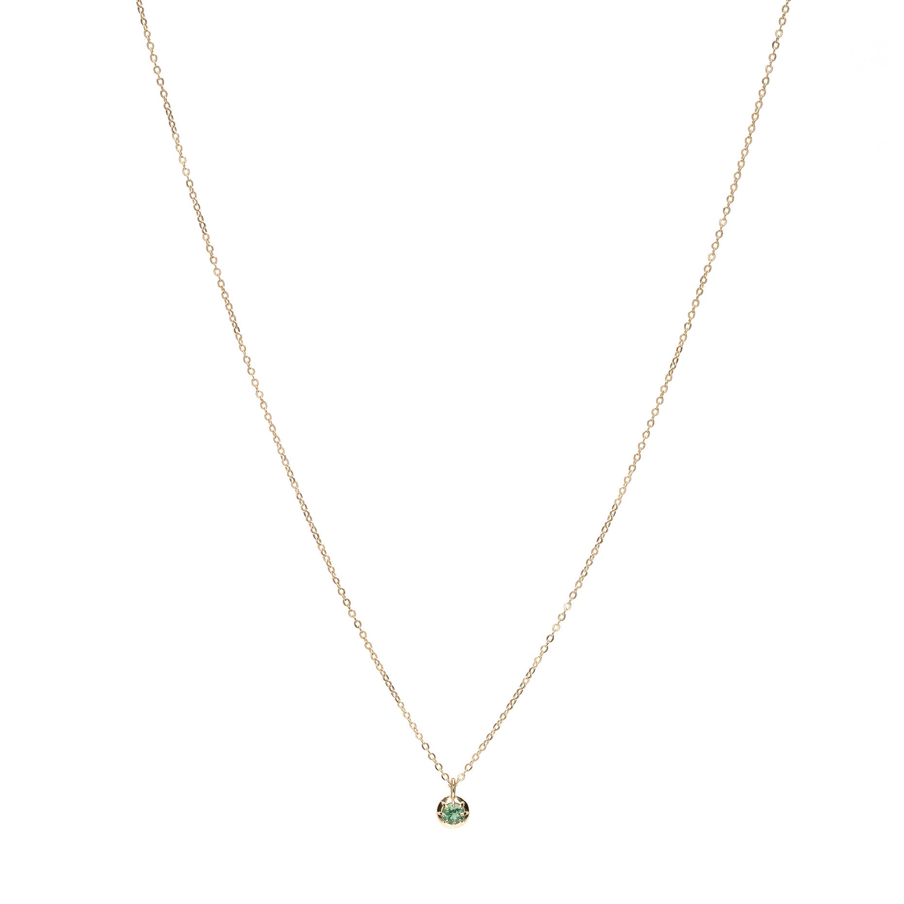 ID NECKLACE NO.2 by ID-N2 gold necklace with fine chain and small green gemstone pendant at center