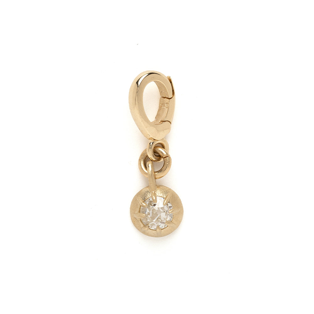 Cora Mini Charm by KM-P11 gold charm with dangling round crystal, shiny matte finish on white background
