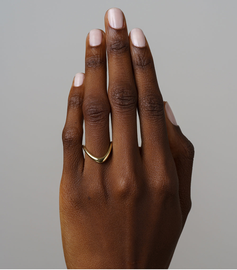Large Melt Band by EGB-R2 wide yellow gold band on hand, shiny smooth rounded profile