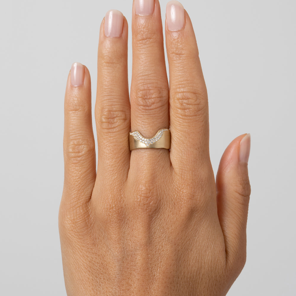 Rolling Hills P-R13-A gold band ring with shiny setting and small diamonds on finger