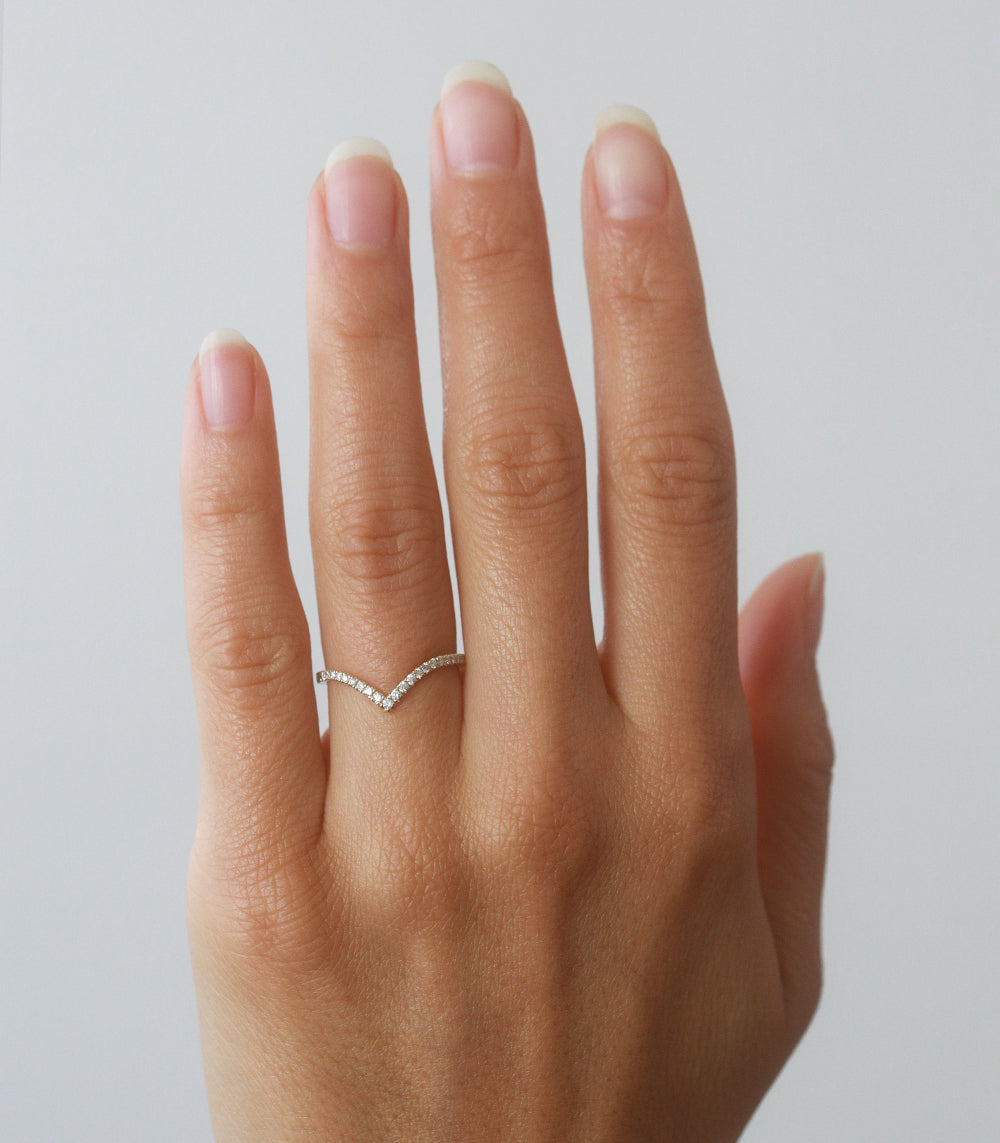 Chevron Band by A-R39-P, slim chevron band with shiny stone-set detail on an open hand